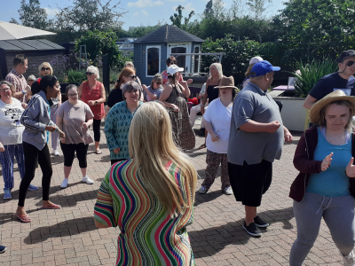 A group image with a staff member and customers