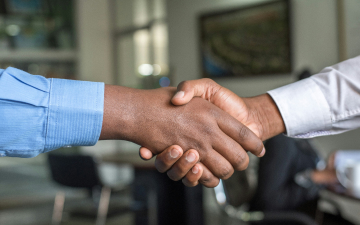 An image of people shaking hands