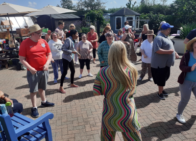 Customers dancing in the garden